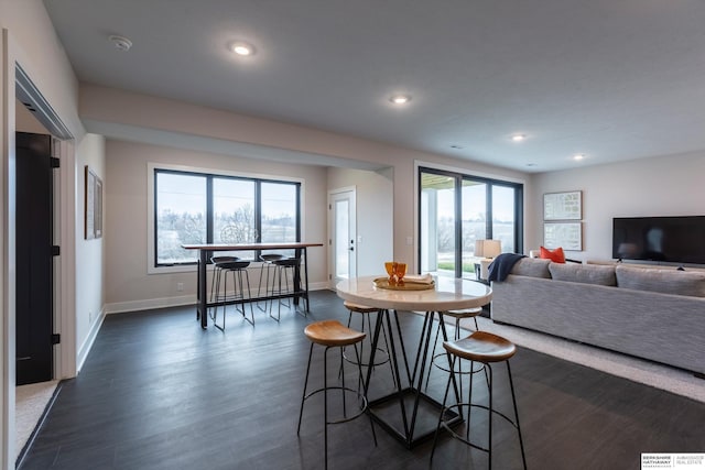 dining area with dark hardwood / wood-style floors