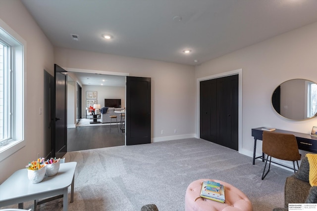 interior space with carpet flooring and a wealth of natural light