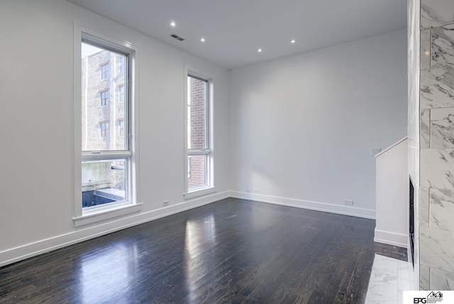 empty room featuring hardwood / wood-style floors