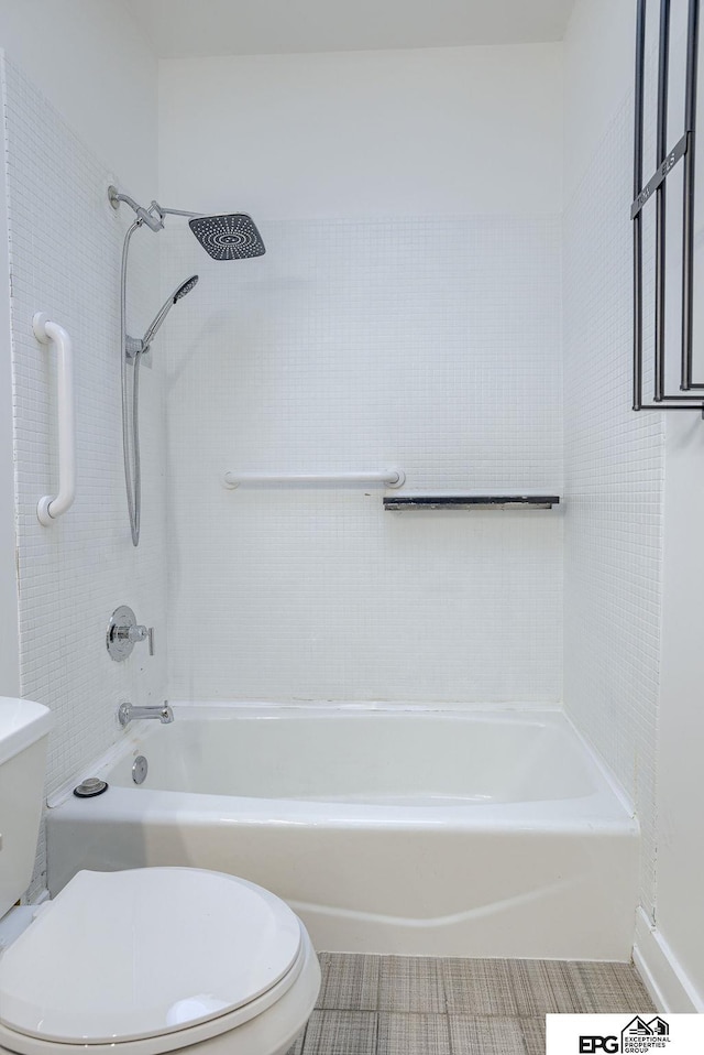 bathroom featuring bathing tub / shower combination and toilet