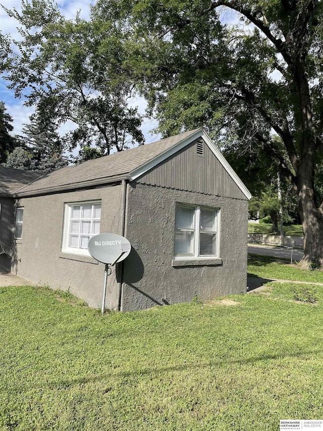 view of home's exterior featuring a lawn