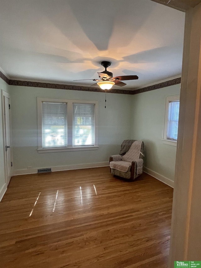 unfurnished room featuring ceiling fan and wood-type flooring