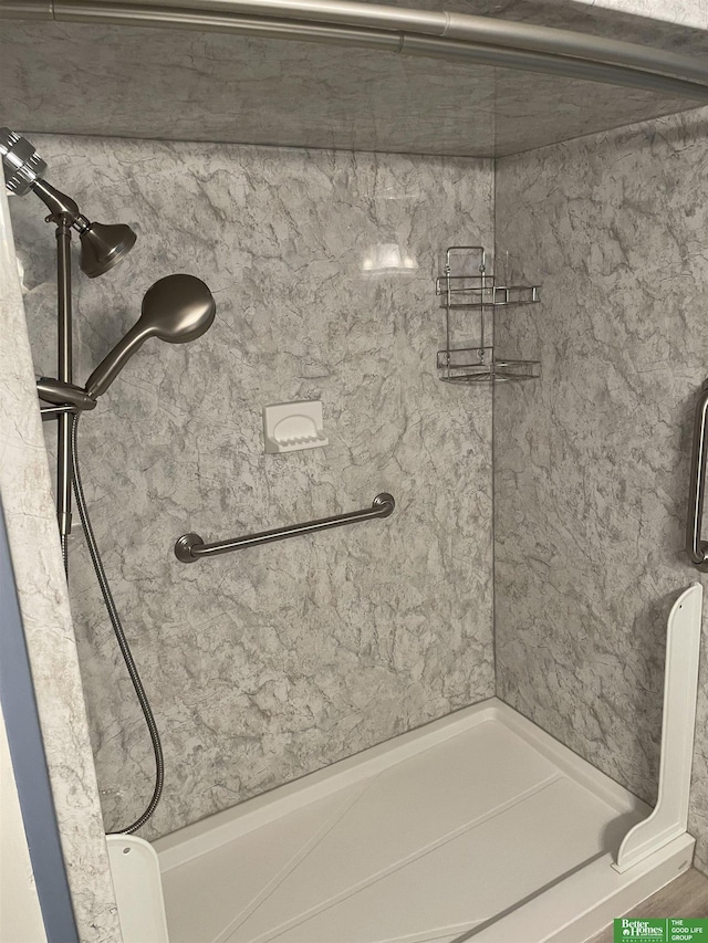 bathroom with tiled shower