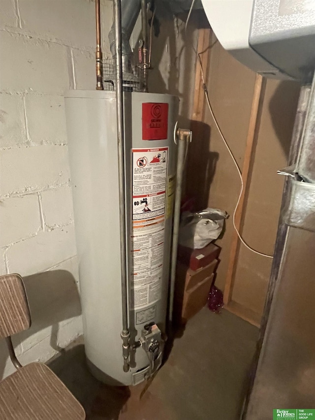 utility room featuring gas water heater