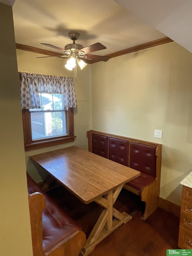 dining space featuring ceiling fan and ornamental molding