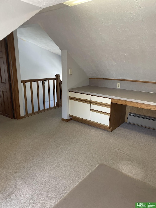 bonus room with a textured ceiling, a baseboard radiator, lofted ceiling, and light colored carpet