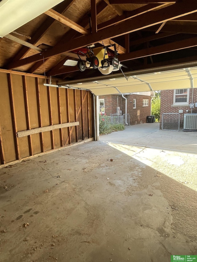 garage with cooling unit and a garage door opener