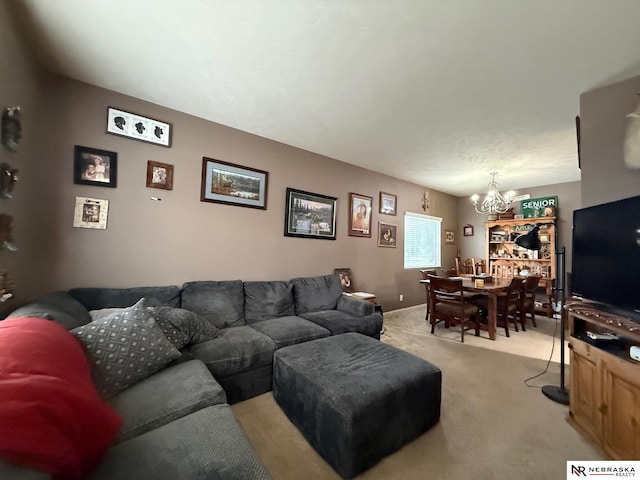 living room with light carpet and a chandelier