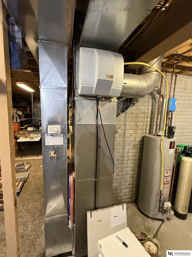 utility room featuring gas water heater