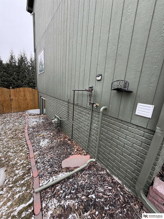 view of home's exterior with fence