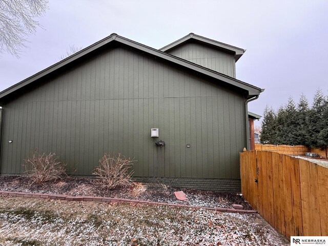 view of home's exterior with fence