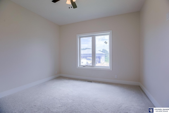 carpeted empty room with ceiling fan