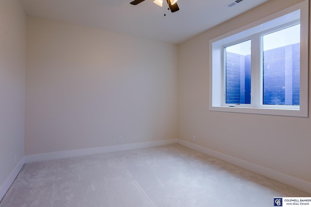 carpeted empty room with ceiling fan