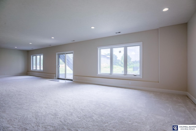 spare room with light carpet