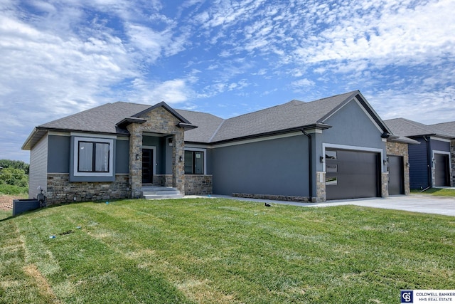 view of front of house featuring a front yard and a garage