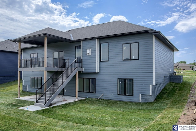 back of house featuring a patio area and a yard