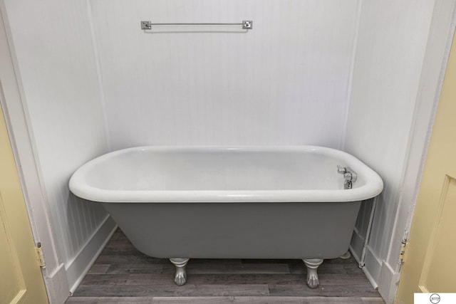 bathroom featuring a bathing tub and wood-type flooring