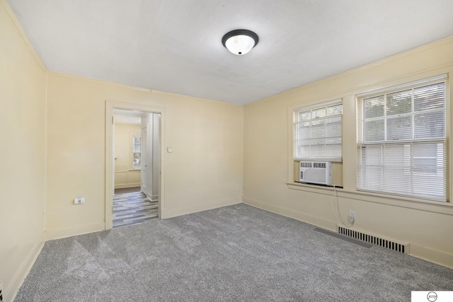 empty room with cooling unit and carpet floors