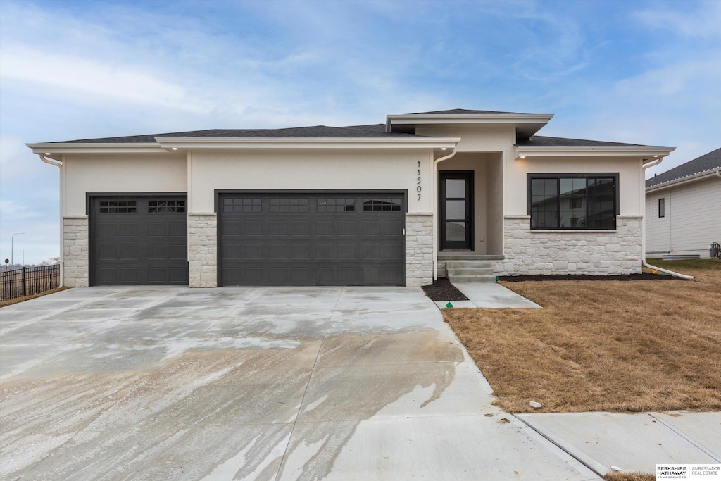 prairie-style house featuring a garage