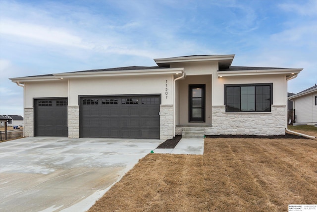 prairie-style home featuring a garage