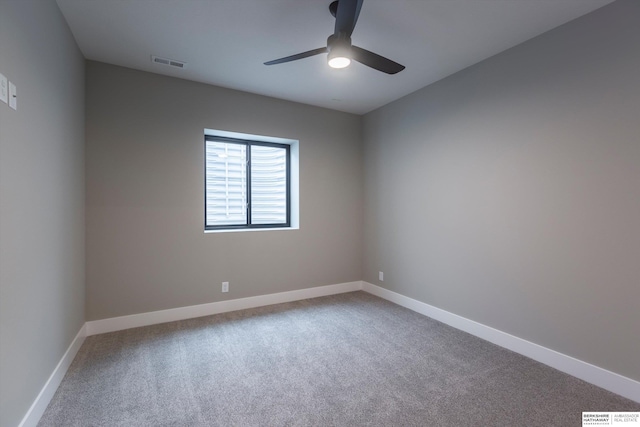 carpeted empty room featuring ceiling fan