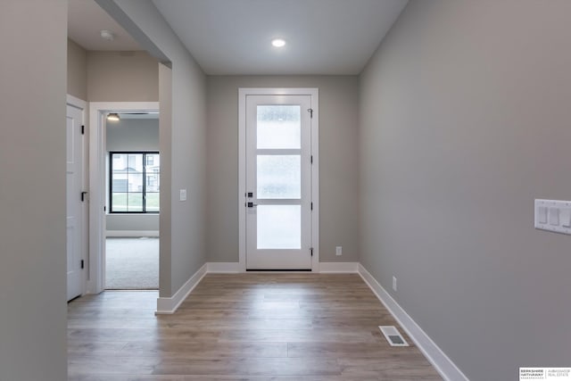 doorway to outside with light hardwood / wood-style floors