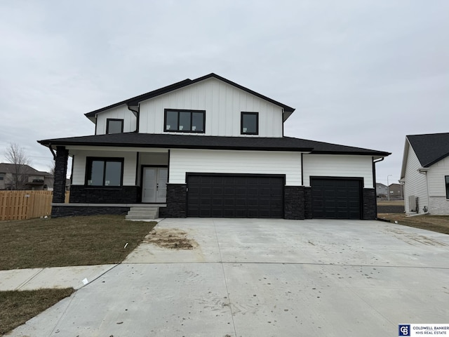 view of front facade with covered porch and a garage