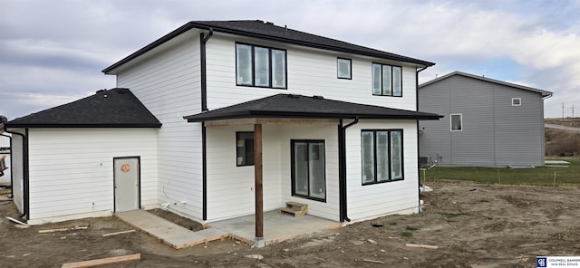 rear view of property featuring a patio area