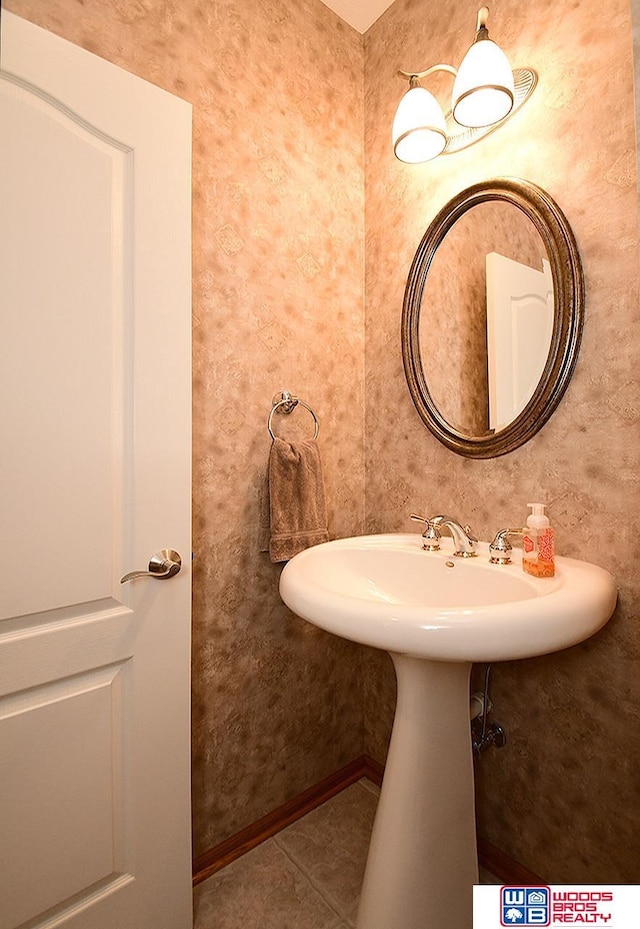 bathroom with tile patterned floors