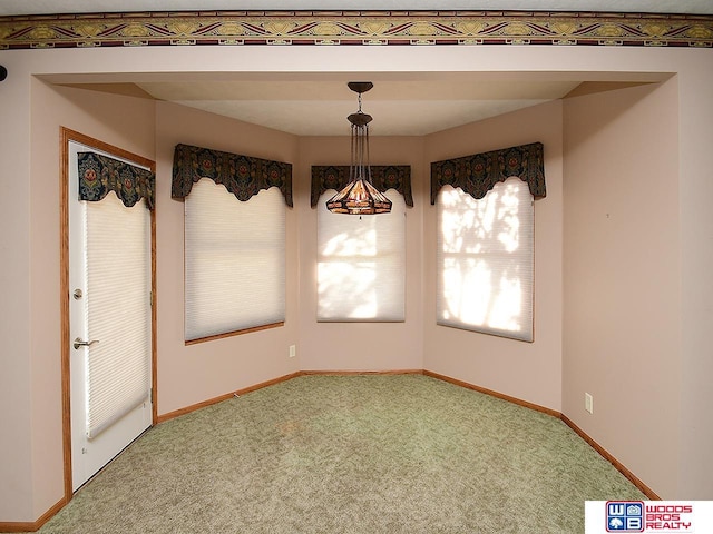 unfurnished dining area with carpet floors