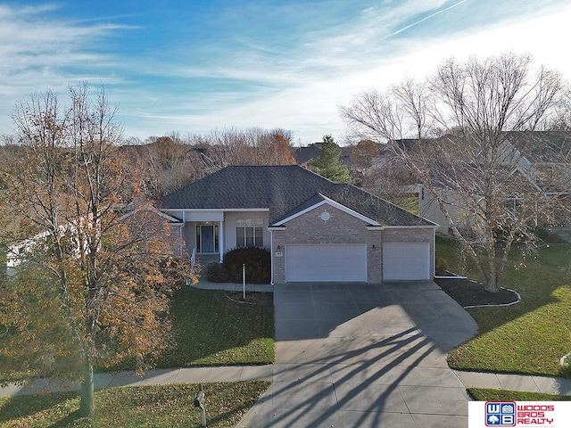 ranch-style house featuring a front yard and a garage