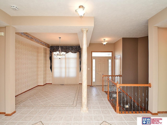 foyer featuring an inviting chandelier