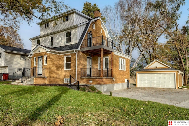 view of front facade with a front lawn, an outbuilding, a balcony, and a garage