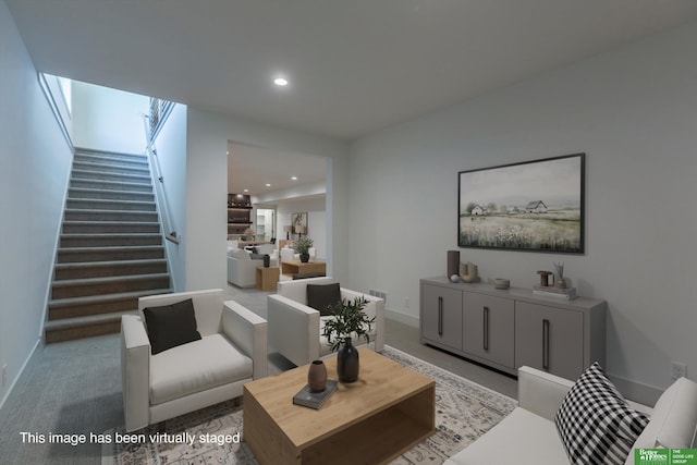 carpeted living room with recessed lighting, baseboards, and stairs