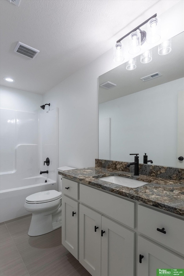 bathroom with toilet, visible vents, shower / bathing tub combination, and vanity