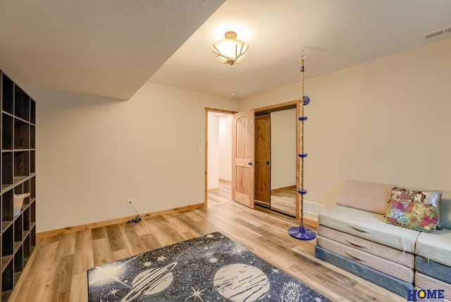 living area with wood-type flooring