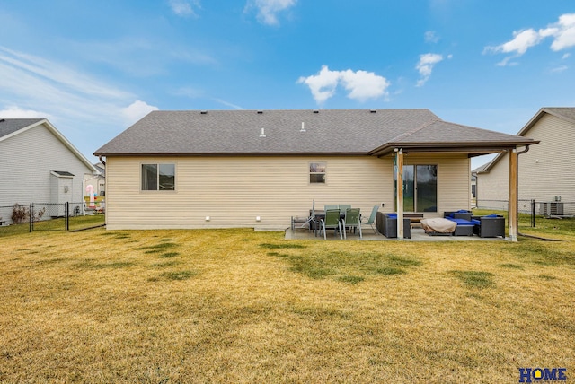 back of house with an outdoor living space, a yard, a patio, and central AC