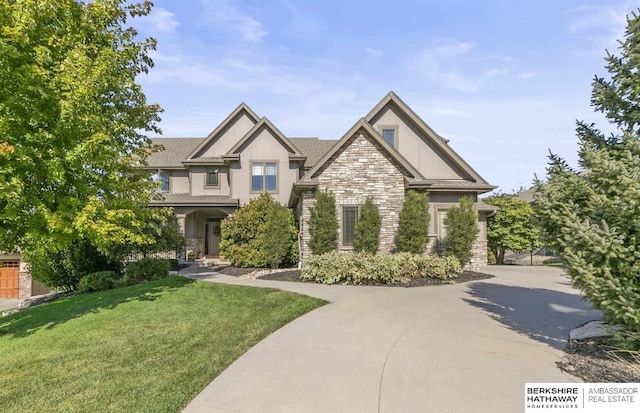 craftsman-style house with a front lawn