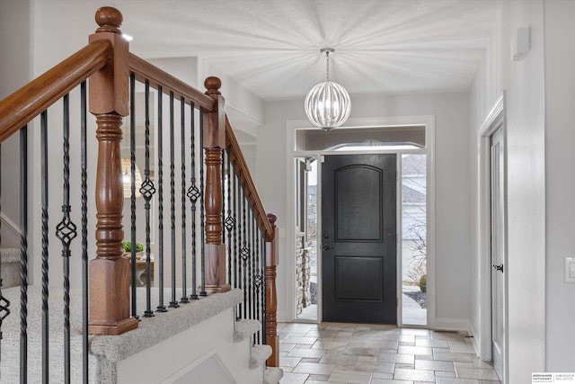 entrance foyer with a notable chandelier