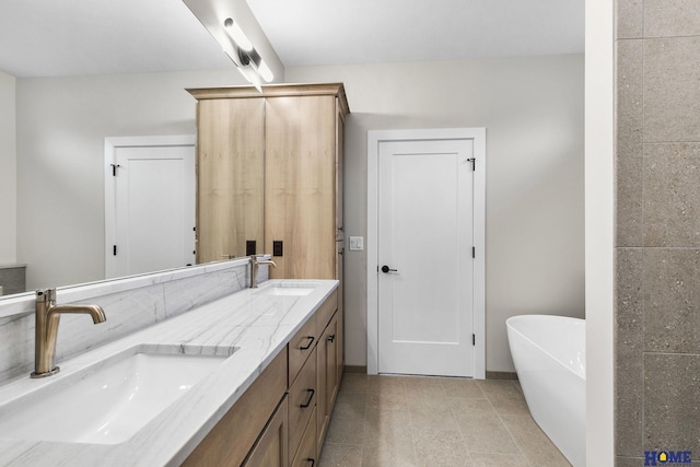 bathroom featuring vanity and a tub