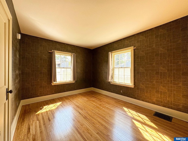 spare room with light wood-type flooring