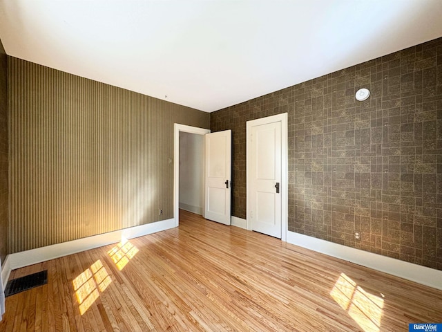 unfurnished bedroom featuring light hardwood / wood-style flooring