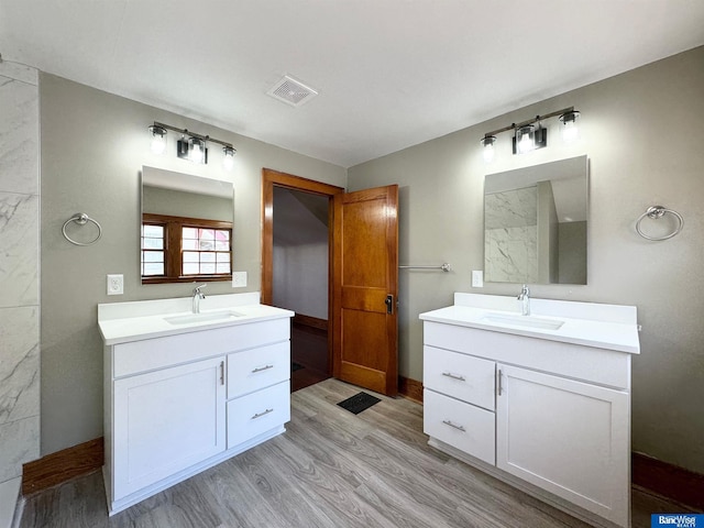 bathroom featuring wood-type flooring and vanity