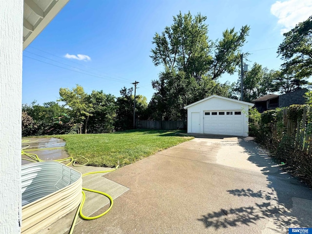 view of yard with an outbuilding and a garage