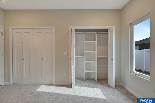 unfurnished bedroom with light carpet