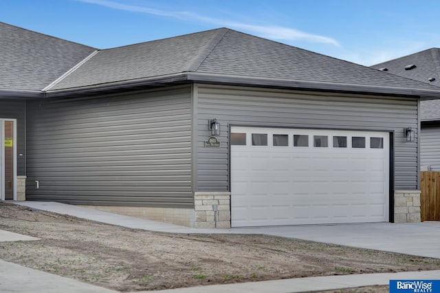 view of side of property featuring a garage