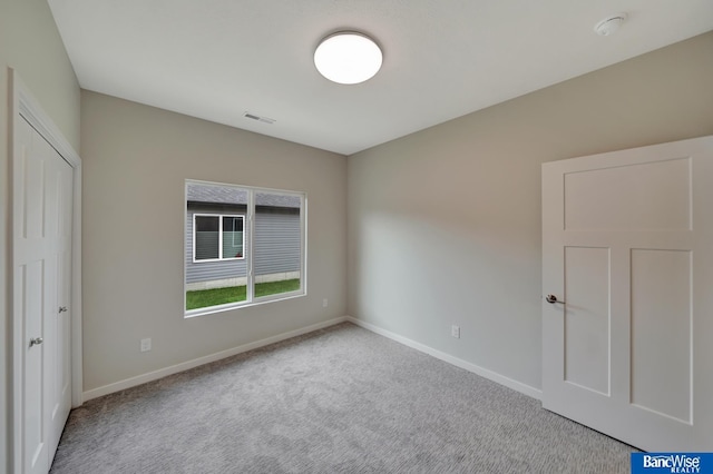 interior space featuring light colored carpet