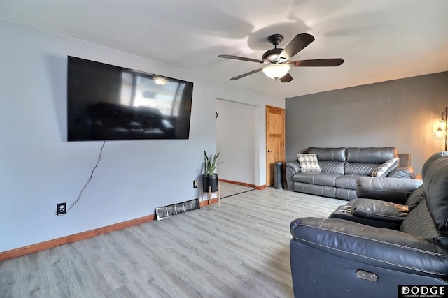 living room with ceiling fan and light hardwood / wood-style floors