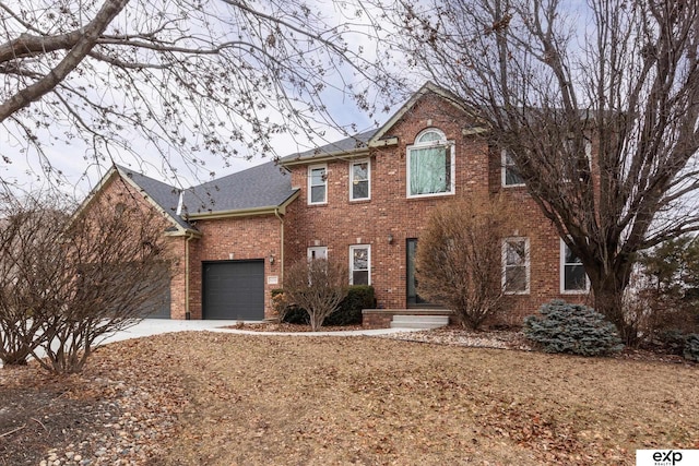 colonial home with a garage