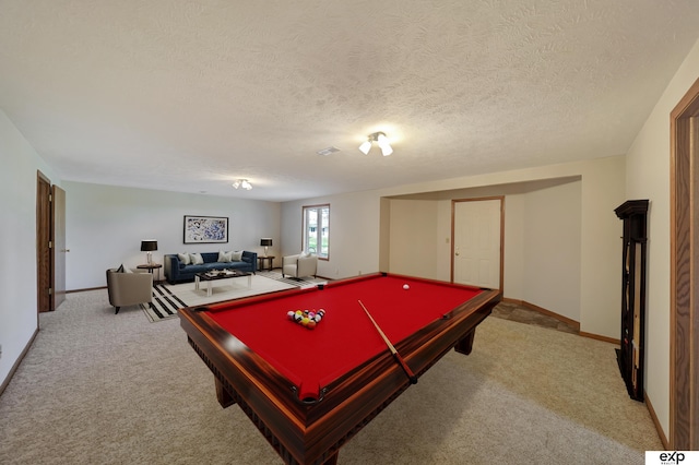 game room with light colored carpet, a textured ceiling, and pool table